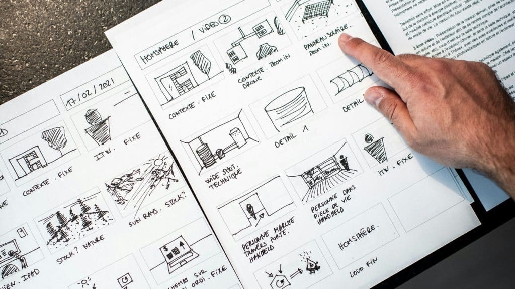 You Should Build An Online Course image of an individual pointing to information on a piece of paper